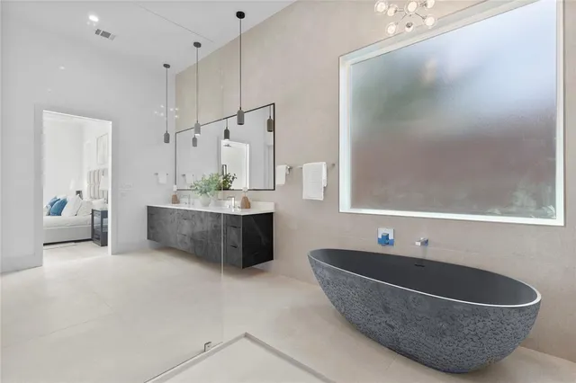 a bathroom with a double vanity sink and mirror