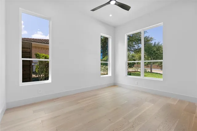 an empty room with windows and entrance