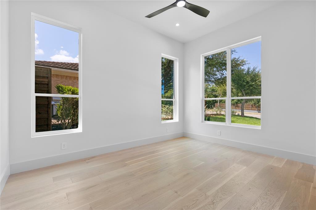 11232 Hillcrest Road Dallas, TX 75230 - Photo 26 of 40 an empty room with windows and entrance
