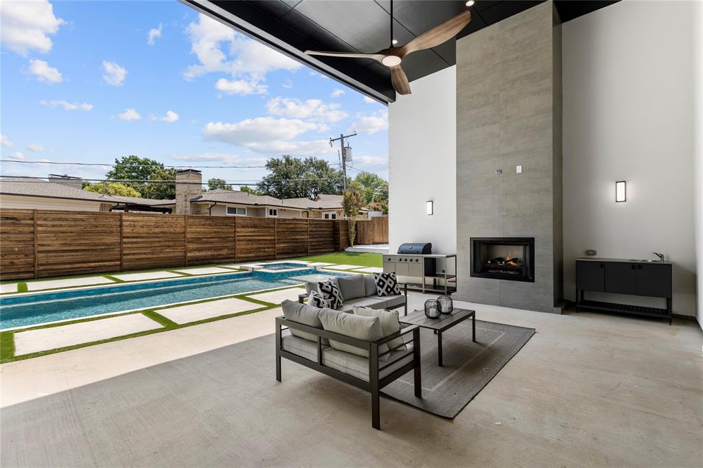 11232 Hillcrest Road Dallas, TX 75230 - Photo 34 of 40 a outdoor living space with furniture and a fireplace