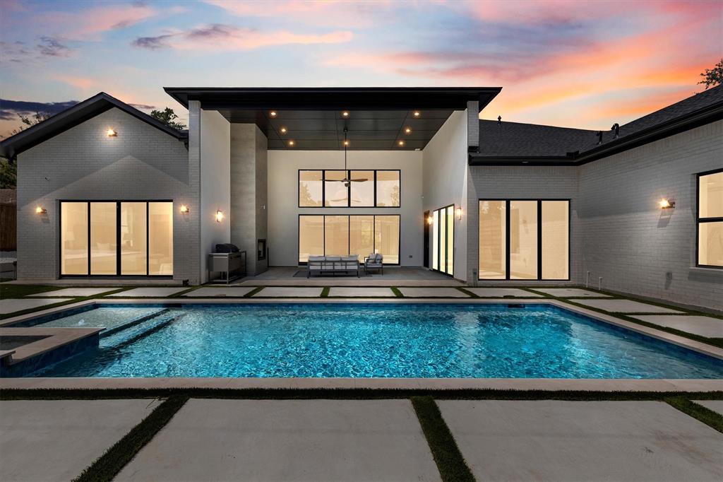 11232 Hillcrest Road Dallas, TX 75230 - Photo 37 of 40 a view of a living room and chandelier