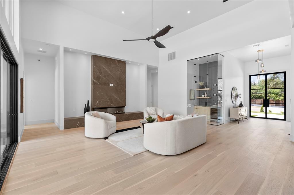 11232 Hillcrest Road Dallas, TX 75230 - Photo 5 of 40 a living room with furniture and a large window
