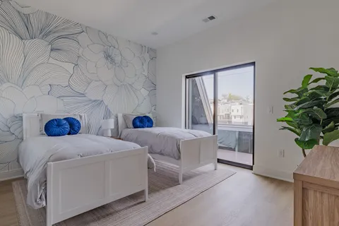 a bedroom with a bed and chair