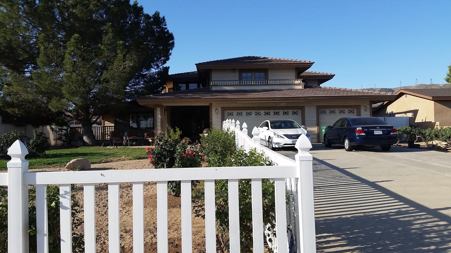a side view of a house with a porch