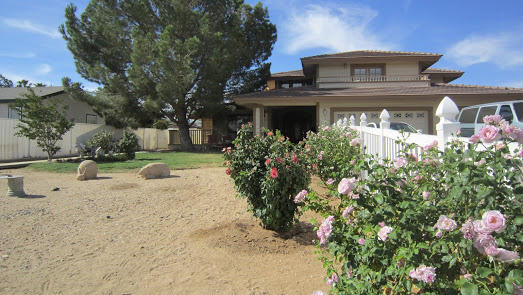 5616 West Ave M-4 Lancaster, CA 93536 - Photo 2 of 12 a front view of house with yard