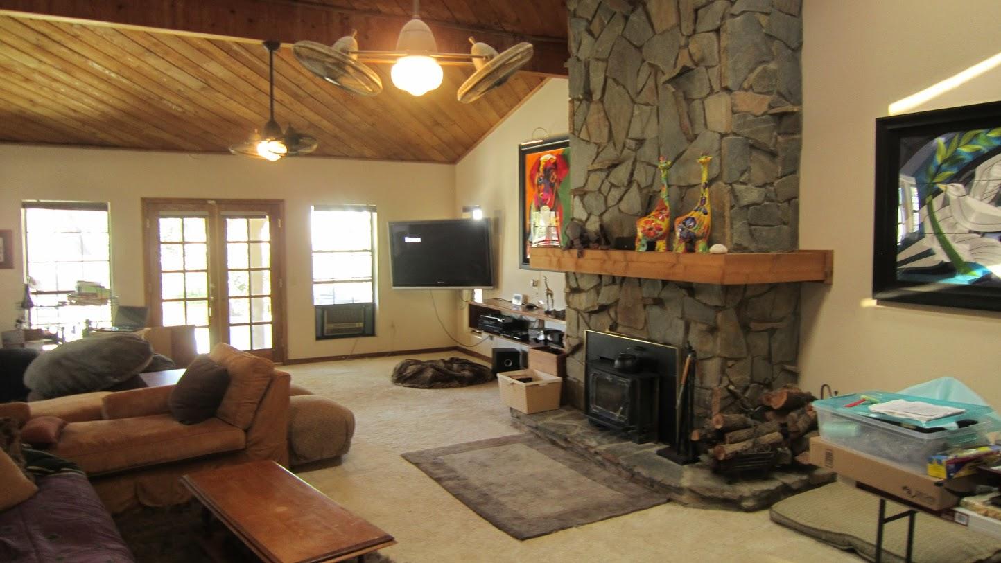 5616 West Ave M-4 Lancaster, CA 93536 - Photo 3 of 12 a living room with furniture a fireplace and a flat screen tv