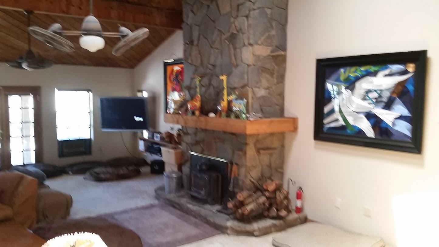 5616 West Ave M-4 Lancaster, CA 93536 - Photo 4 of 12 a living room with furniture a fireplace and decor