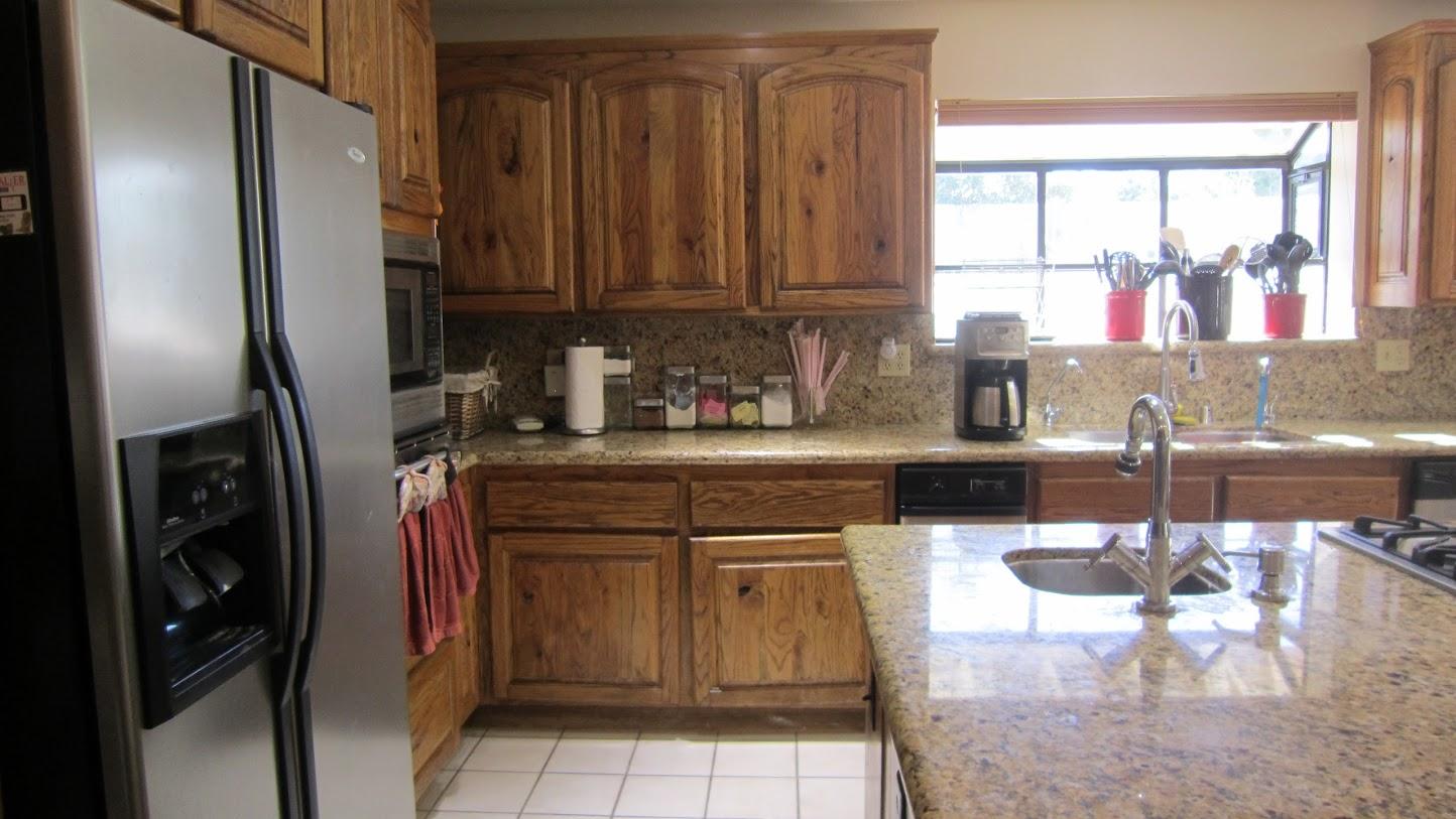 5616 West Ave M-4 Lancaster, CA 93536 - Photo 6 of 12 a kitchen with stainless steel appliances granite countertop a refrigerator and a sink