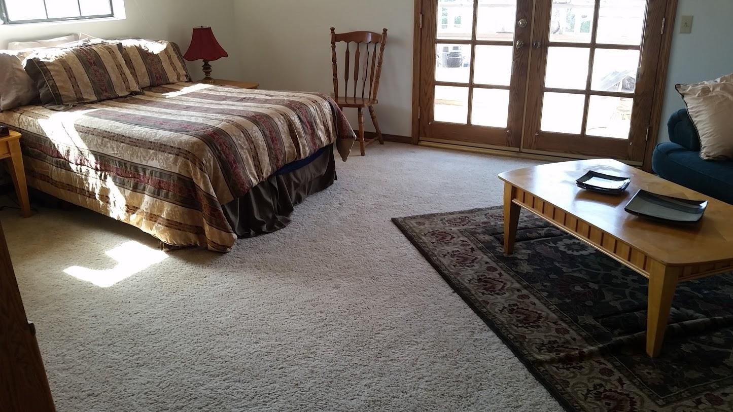 5616 West Ave M-4 Lancaster, CA 93536 - Photo 7 of 12 a spacious bedroom with a bed and a window
