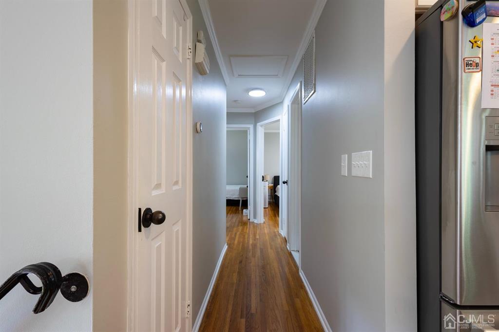 53 Edgemere Avenue Plainsboro, NJ 08536 - Photo 11 of 39 a view of a hallway with wooden floor