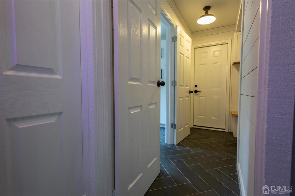 53 Edgemere Avenue Plainsboro, NJ 08536 - Photo 23 of 39 a bathroom with a glass shower door