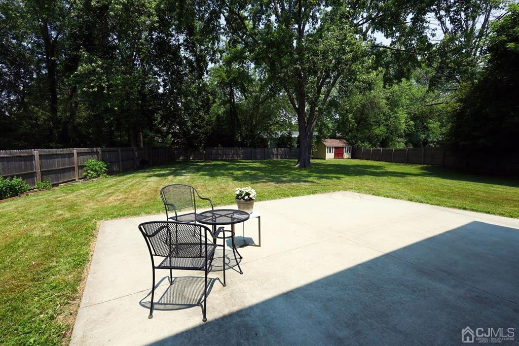 53 Edgemere Avenue Plainsboro, NJ 08536 - Photo 39 of 39 a view of a swimming pool with a table and chairs