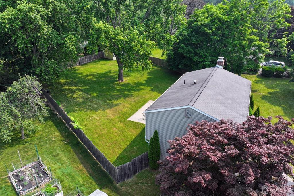 53 Edgemere Avenue Plainsboro, NJ 08536 - Photo 6 of 39 a view of a garden with a house in the background