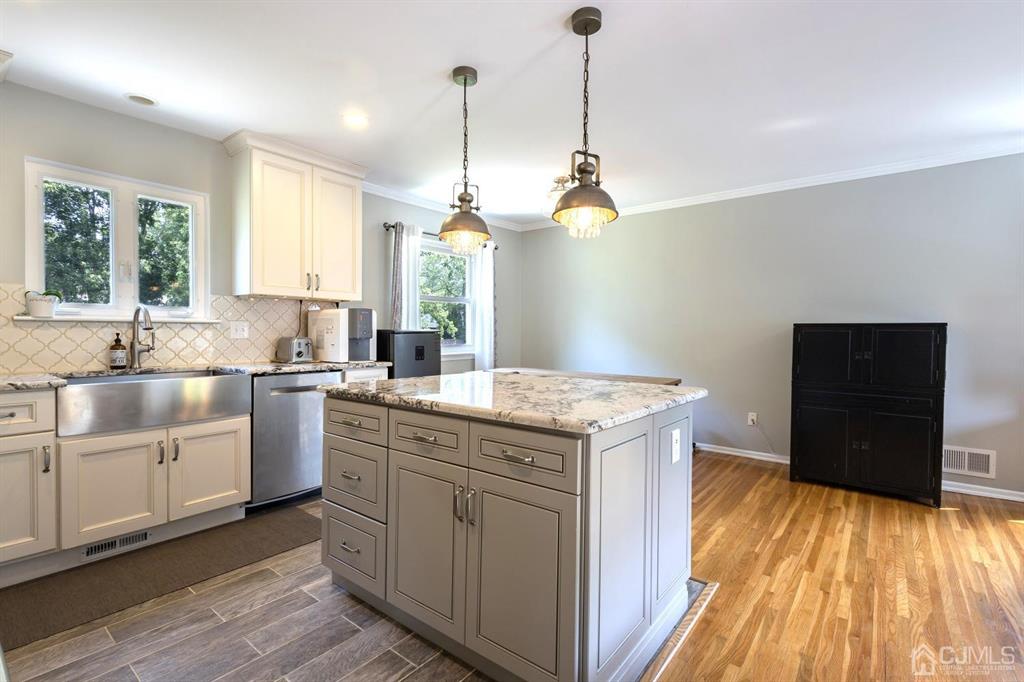 53 Edgemere Avenue Plainsboro, NJ 08536 - Photo 8 of 39 a kitchen with sink stove and refrigerator