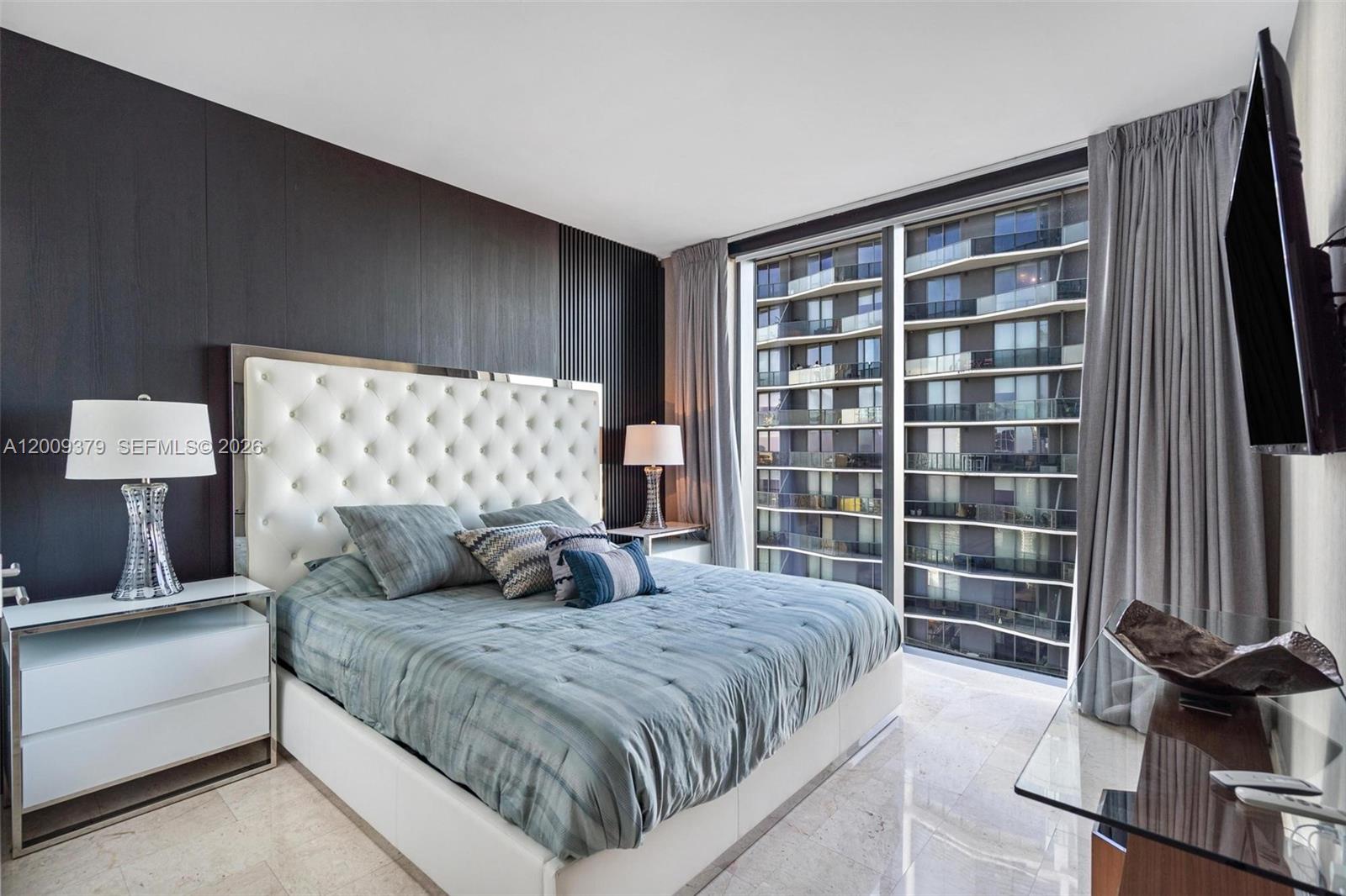 88 Southwest 7th Street, Unit 3801 Miami, FL 33130 - Photo 18 of 87 a bedroom with a bed and a window