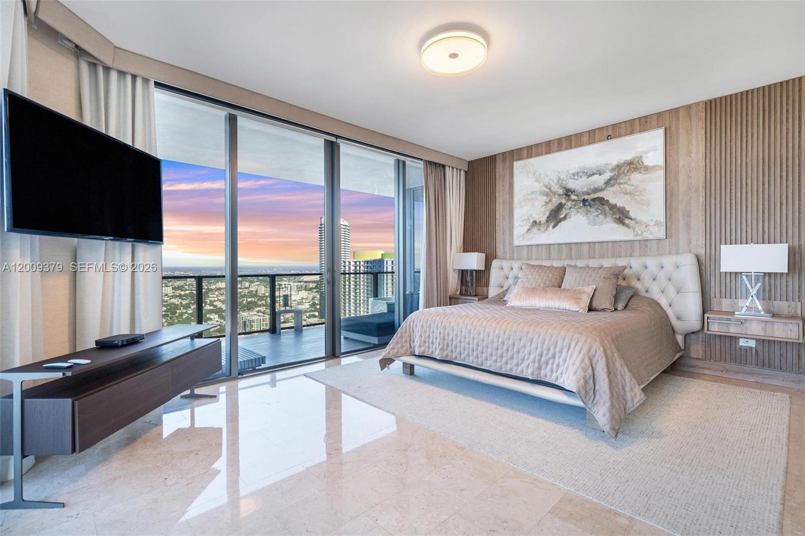 88 Southwest 7th Street, Unit 3801 Miami, FL 33130 - Photo 22 of 87 a spacious bedroom with a large bed and a flat tv screen