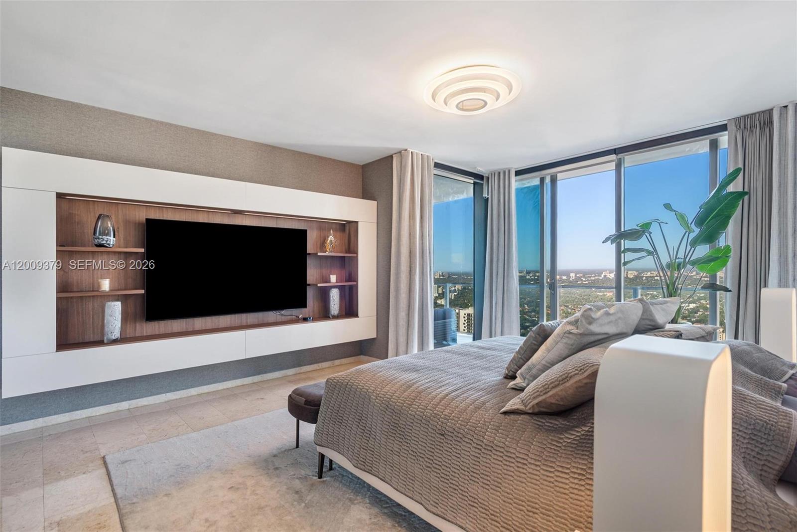 88 Southwest 7th Street, Unit 3801 Miami, FL 33130 - Photo 35 of 87 a bedroom with a bed and a flat screen tv