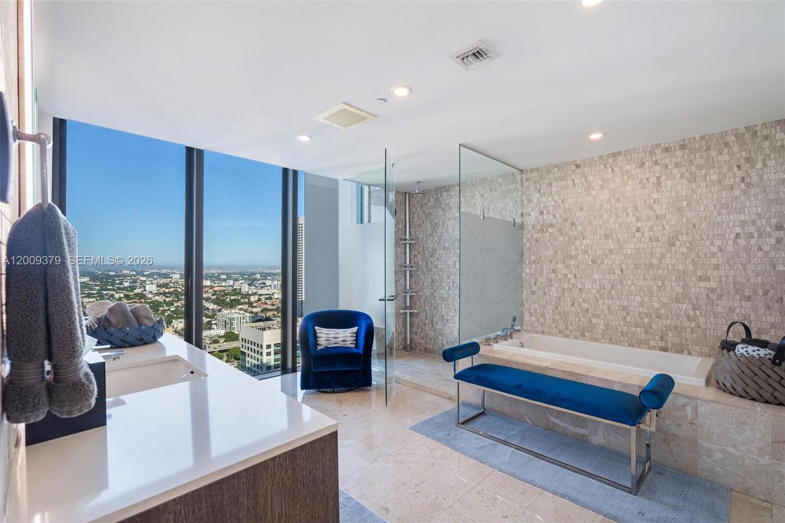88 Southwest 7th Street, Unit 3801 Miami, FL 33130 - Photo 40 of 87 a spacious bedroom with a bed and large window