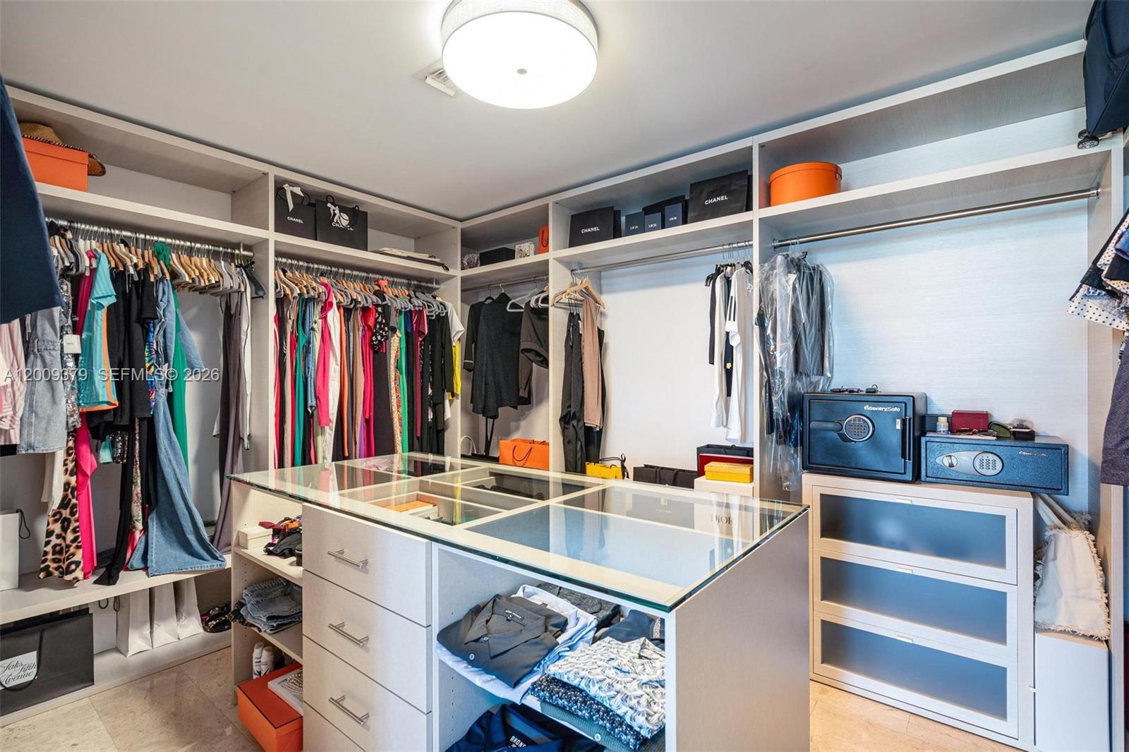 88 Southwest 7th Street, Unit 3801 Miami, FL 33130 - Photo 42 of 87 a view of walk in closet with clothes and shoes
