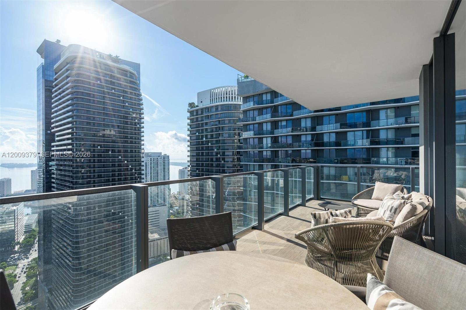 88 Southwest 7th Street, Unit 3801 Miami, FL 33130 - Photo 46 of 87 a balcony view with a couple of chairs