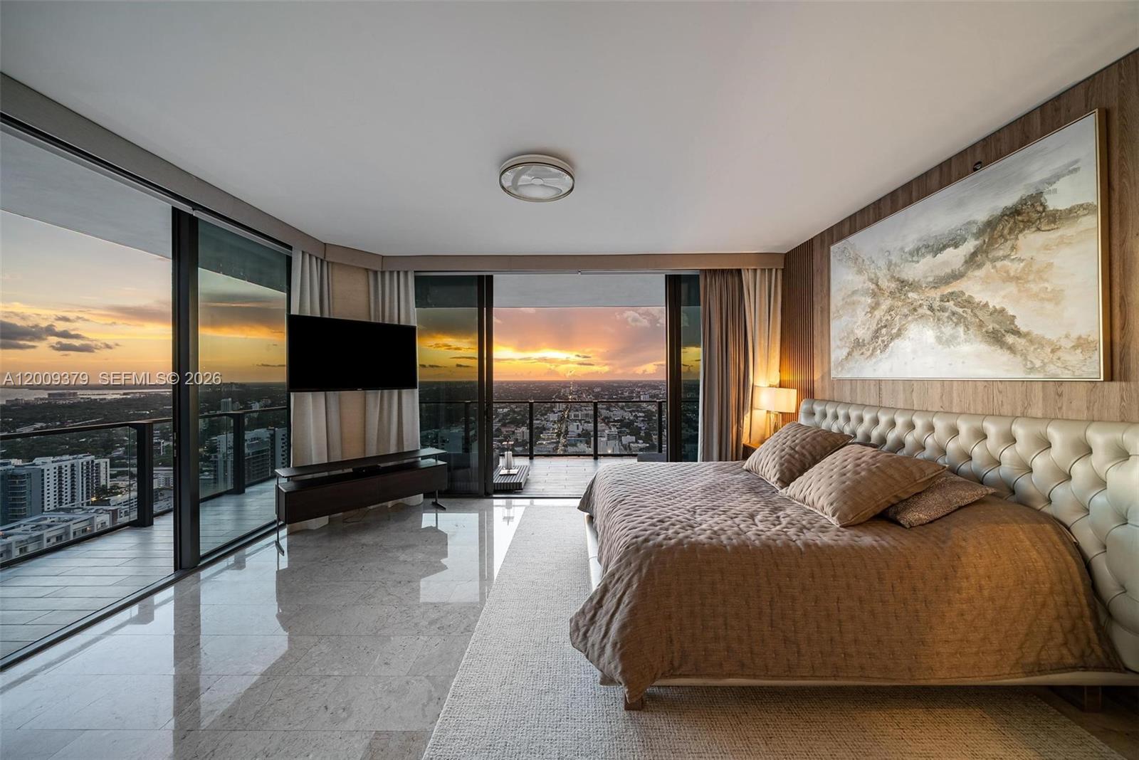 88 Southwest 7th Street, Unit 3801 Miami, FL 33130 - Photo 65 of 87 a spacious bedroom with a bed and glass walk in closet