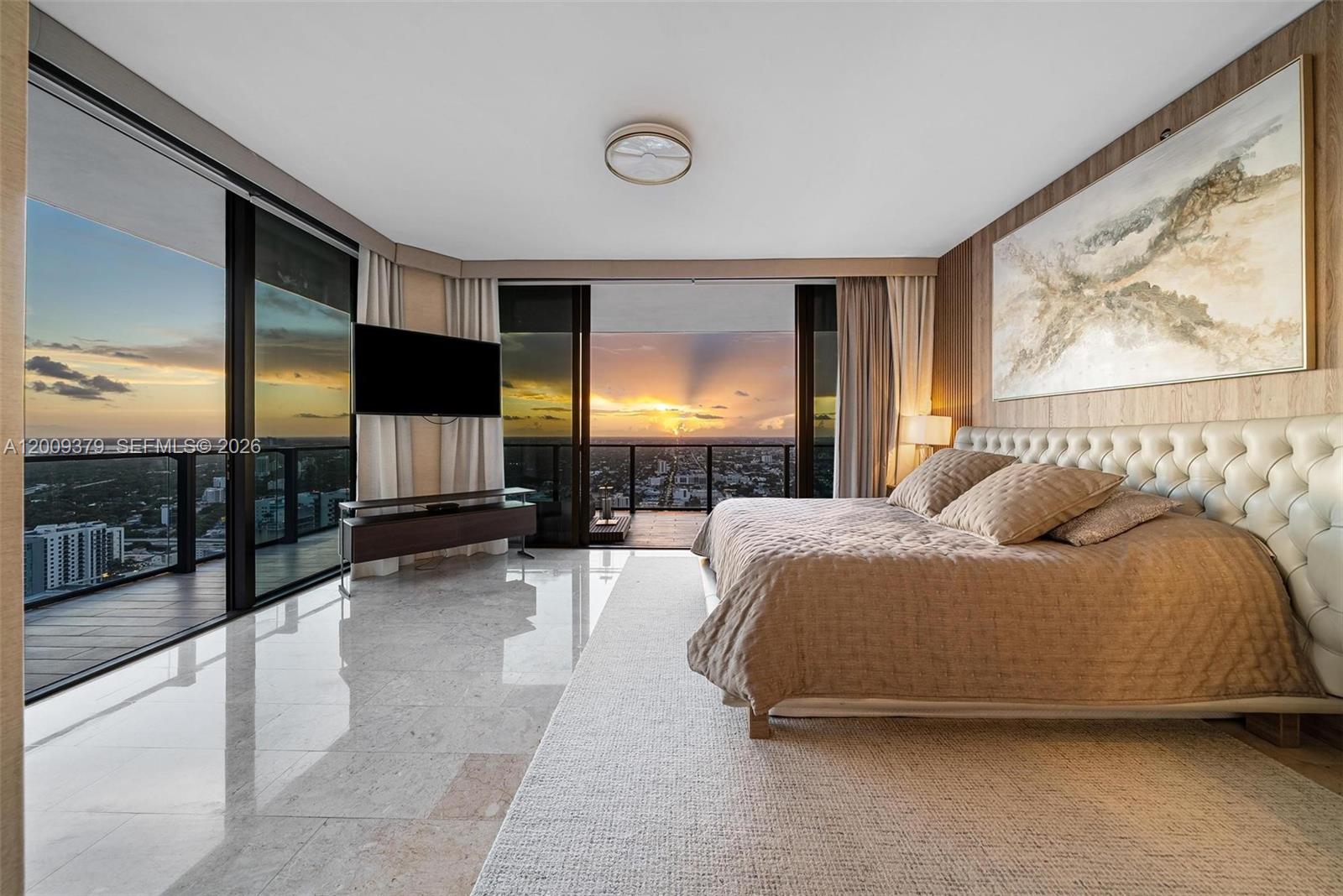 88 Southwest 7th Street, Unit 3801 Miami, FL 33130 - Photo 69 of 87 a spacious bedroom with a bed and large window