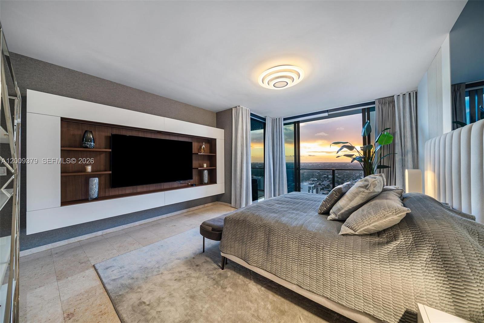 88 Southwest 7th Street, Unit 3801 Miami, FL 33130 - Photo 81 of 87 a bedroom with a bed and a large window