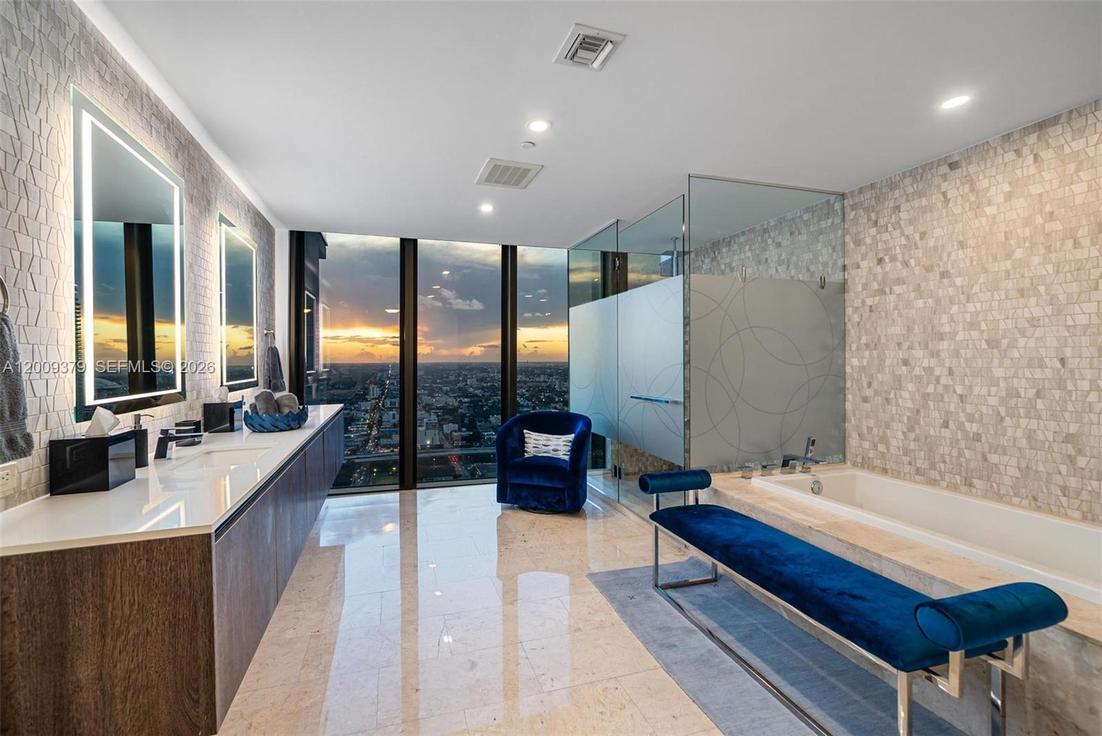 88 Southwest 7th Street, Unit 3801 Miami, FL 33130 - Photo 82 of 87 a bathroom with double vanity and a bathtub