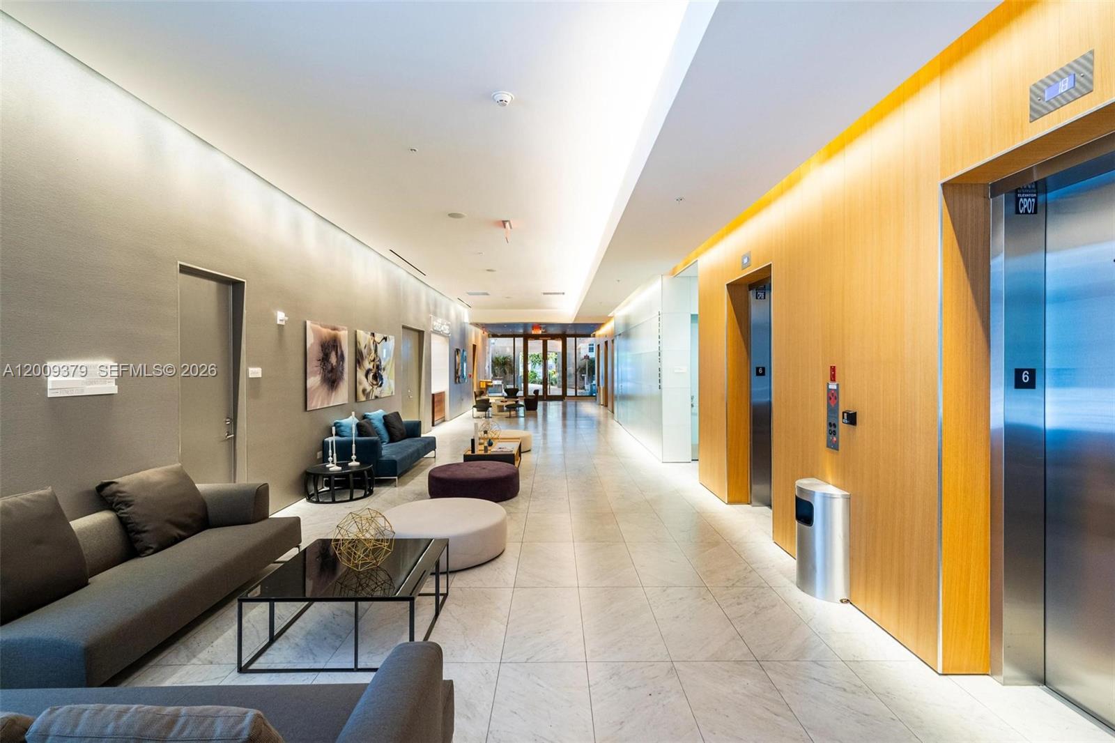 88 Southwest 7th Street, Unit 3801 Miami, FL 33130 - Photo 84 of 87 a lobby with furniture and a table