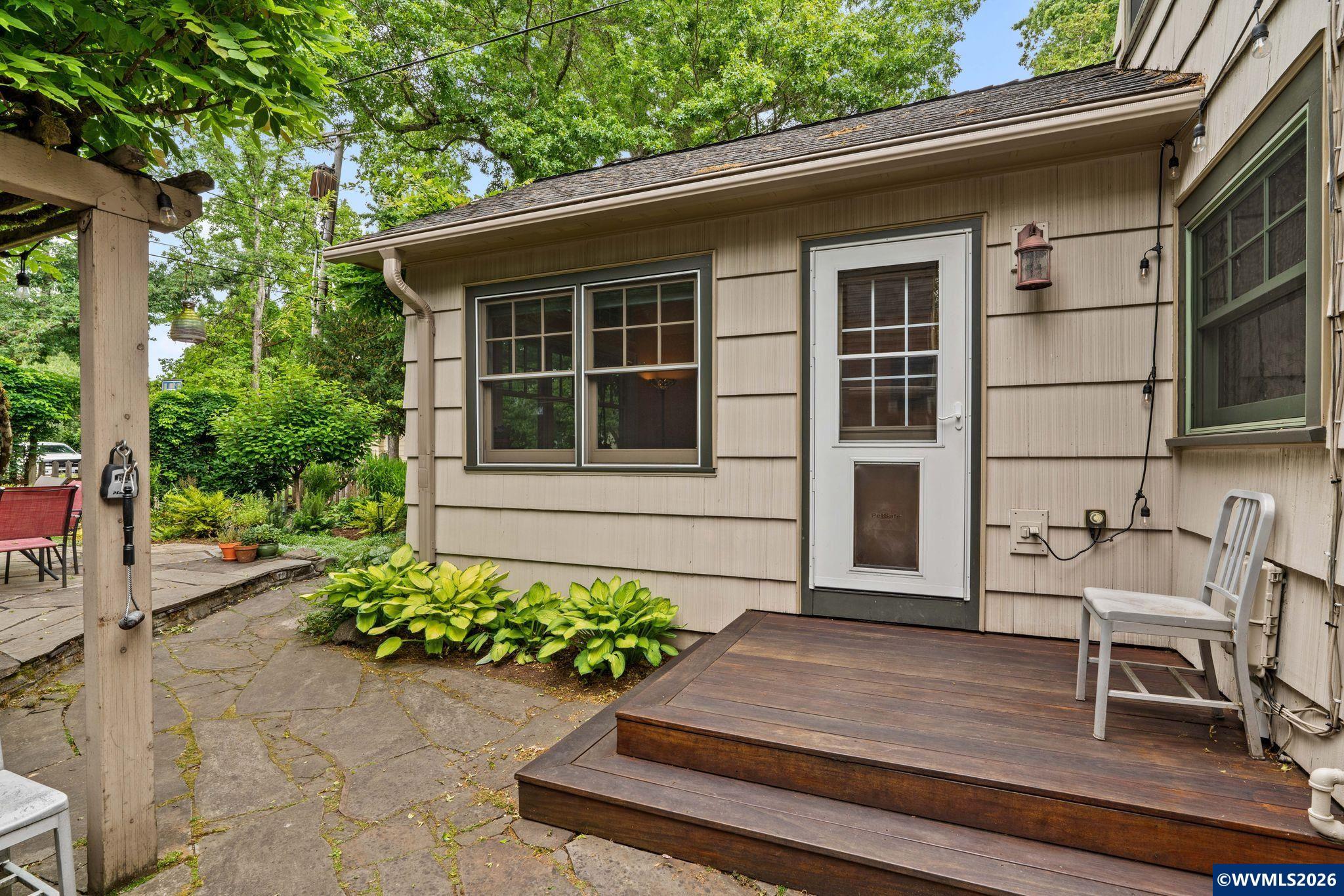 444 Northwest 35th Street Corvallis, OR 97330 - Photo 40 of 40 a house with a bench and potted plants