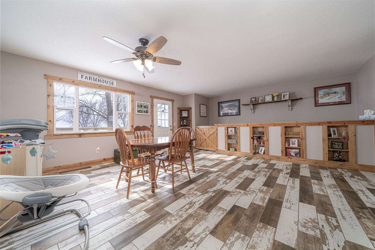 1785 Willow Road Franklin Grove, IL 61031 - Photo 11 of 38 a dining room with furniture and window