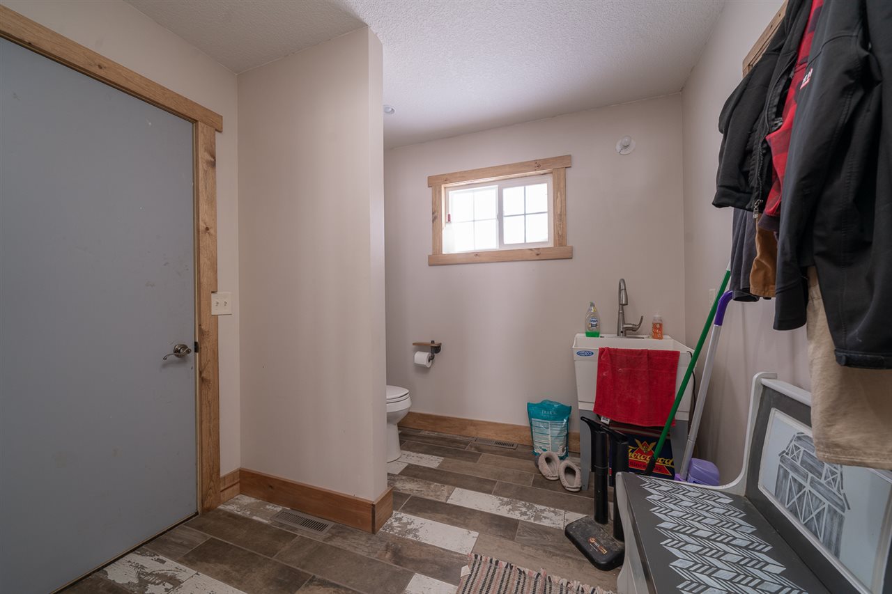 1785 Willow Road Franklin Grove, IL 61031 - Photo 22 of 38 a room with furniture a flat screen tv and a window