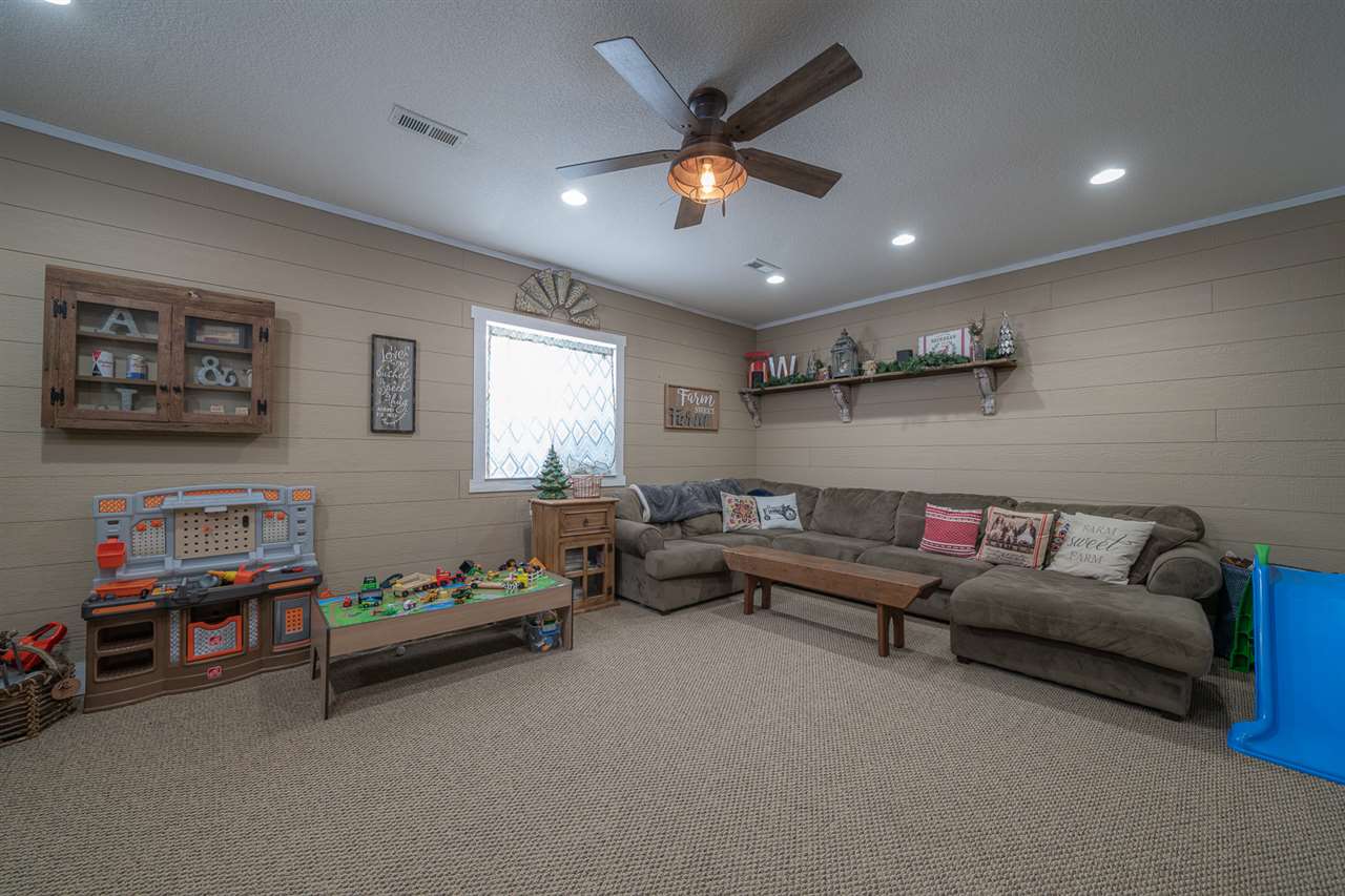 1785 Willow Road Franklin Grove, IL 61031 - Photo 24 of 38 a living room with furniture and a window