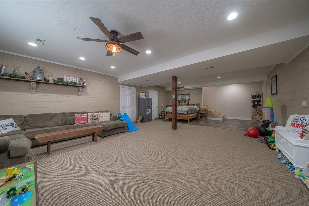 1785 Willow Road Franklin Grove, IL 61031 - Photo 26 of 38 a living room with furniture and kitchen view