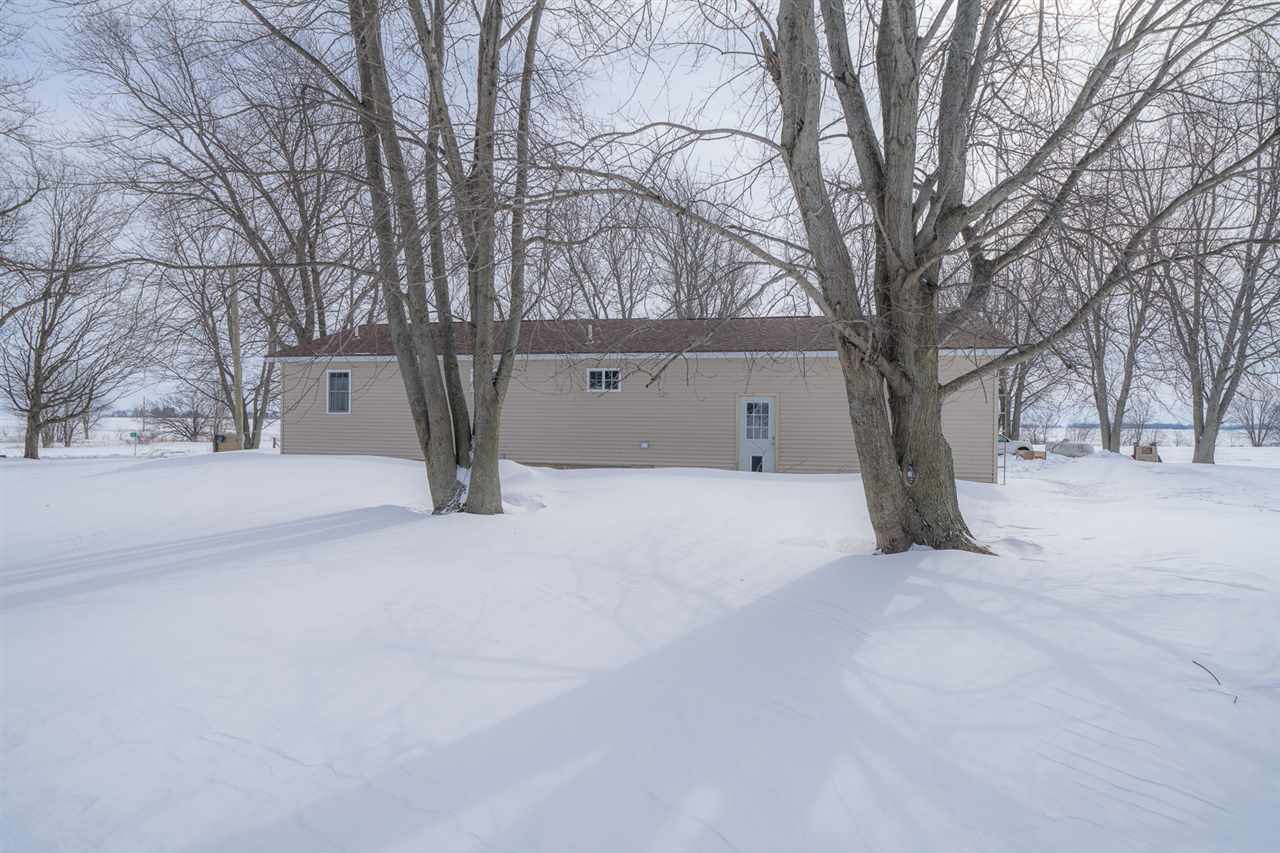 1785 Willow Road Franklin Grove, IL 61031 - Photo 35 of 38 a view of white house with a yard