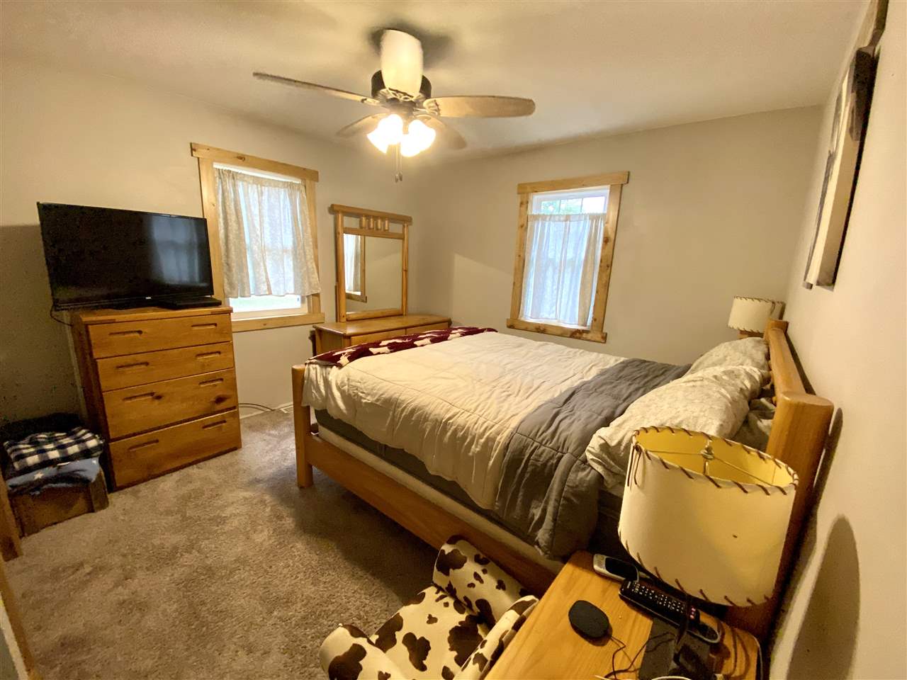 1785 Willow Road Franklin Grove, IL 61031 - Photo 37 of 38 a bedroom with a bed and flat screen tv