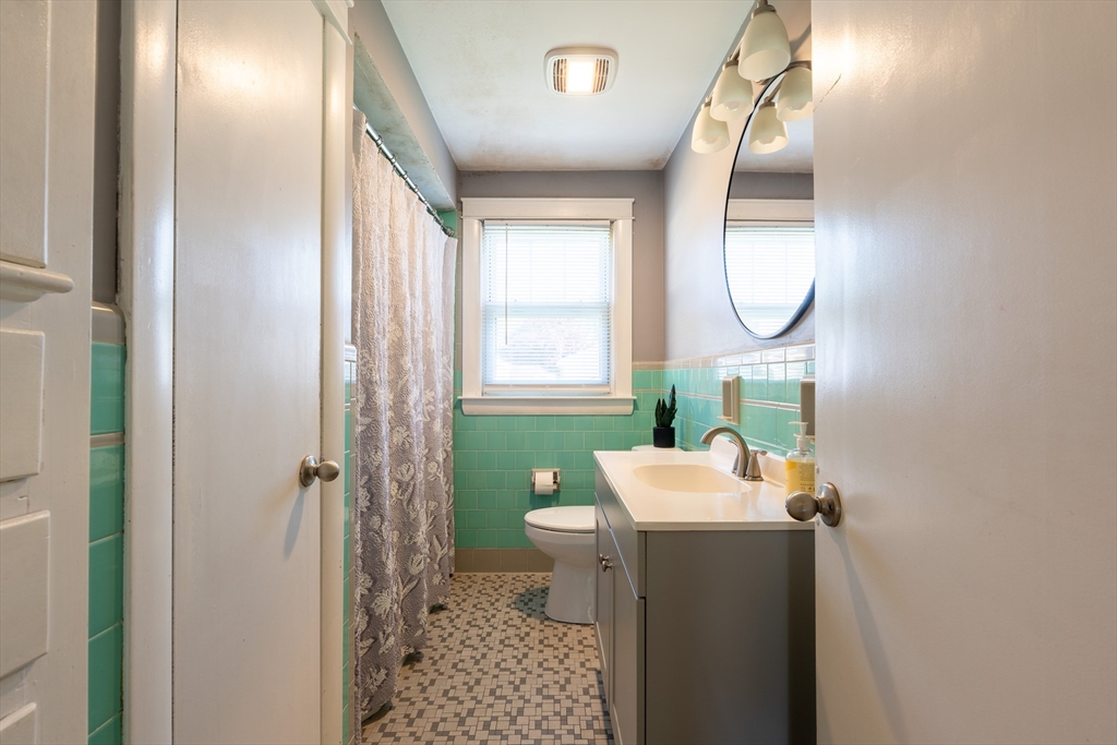110 James M Beardsworth Road Tiverton, RI 02878 - Photo 12 of 26 a bathroom with a sink a toilet and shower