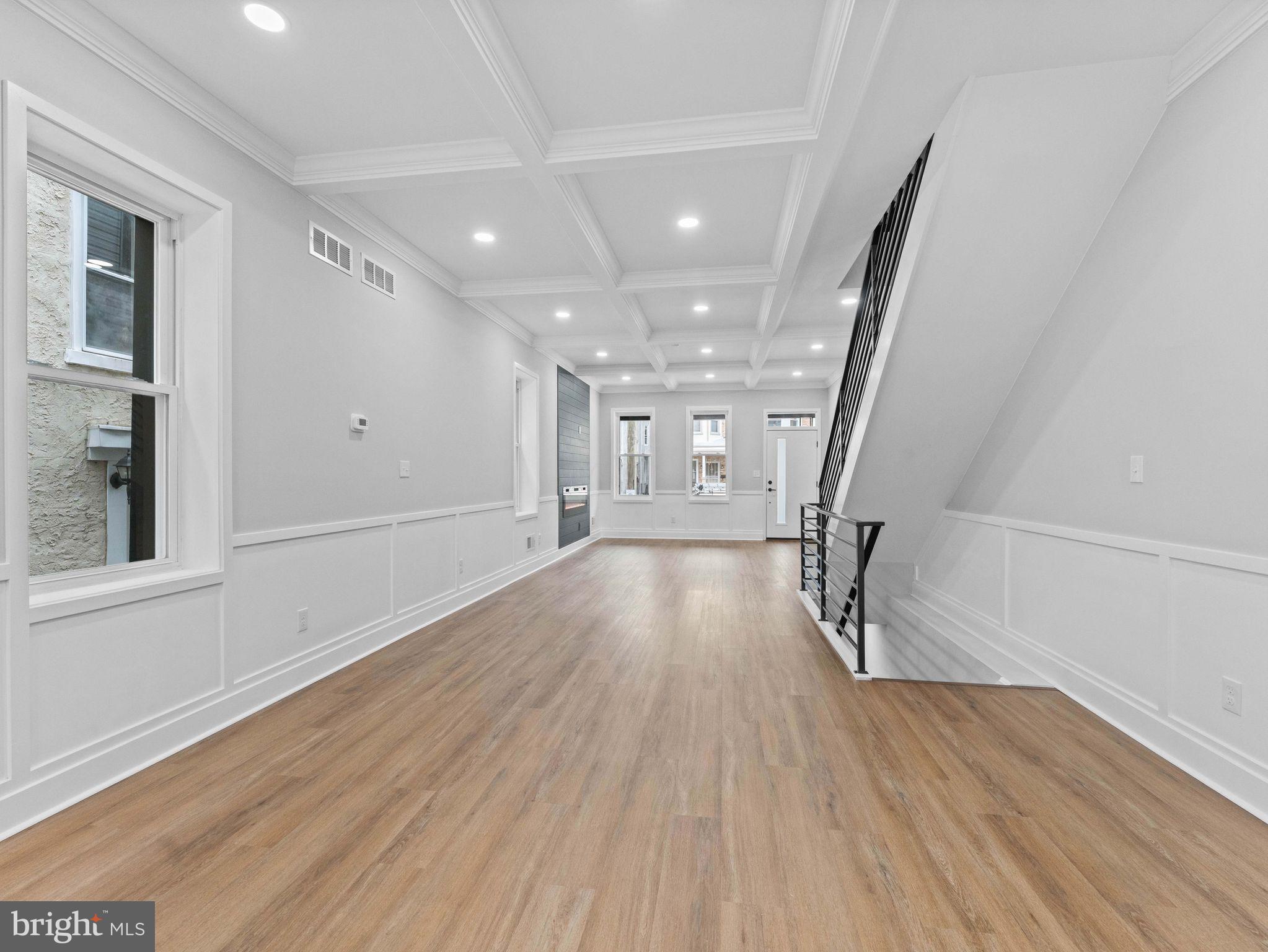 138 West Sharpnack Street Philadelphia, PA 19119 - Photo 13 of 44 wooden floor in an empty room with a window