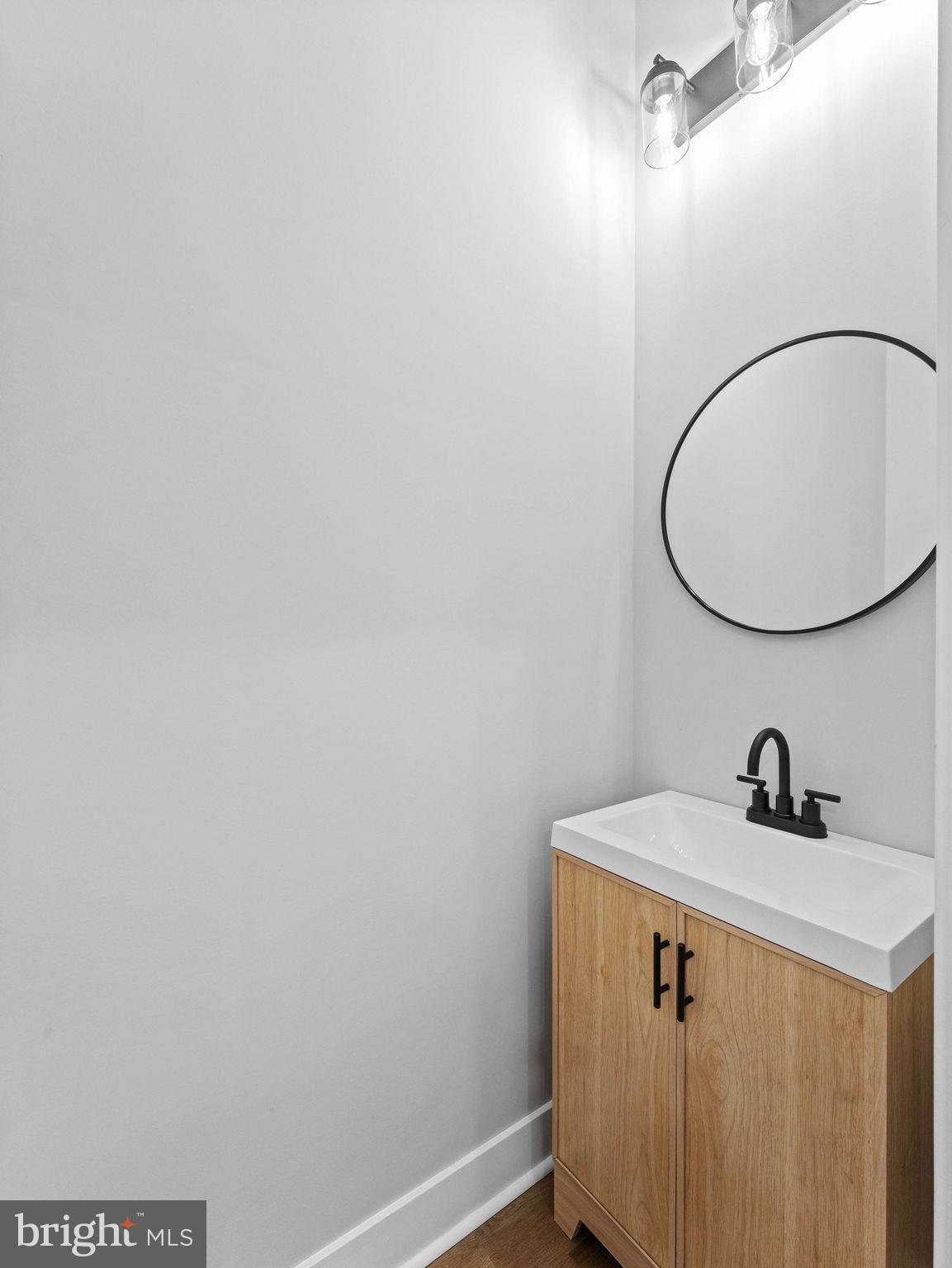 138 West Sharpnack Street Philadelphia, PA 19119 - Photo 19 of 44 a bathroom with a sink and mirror