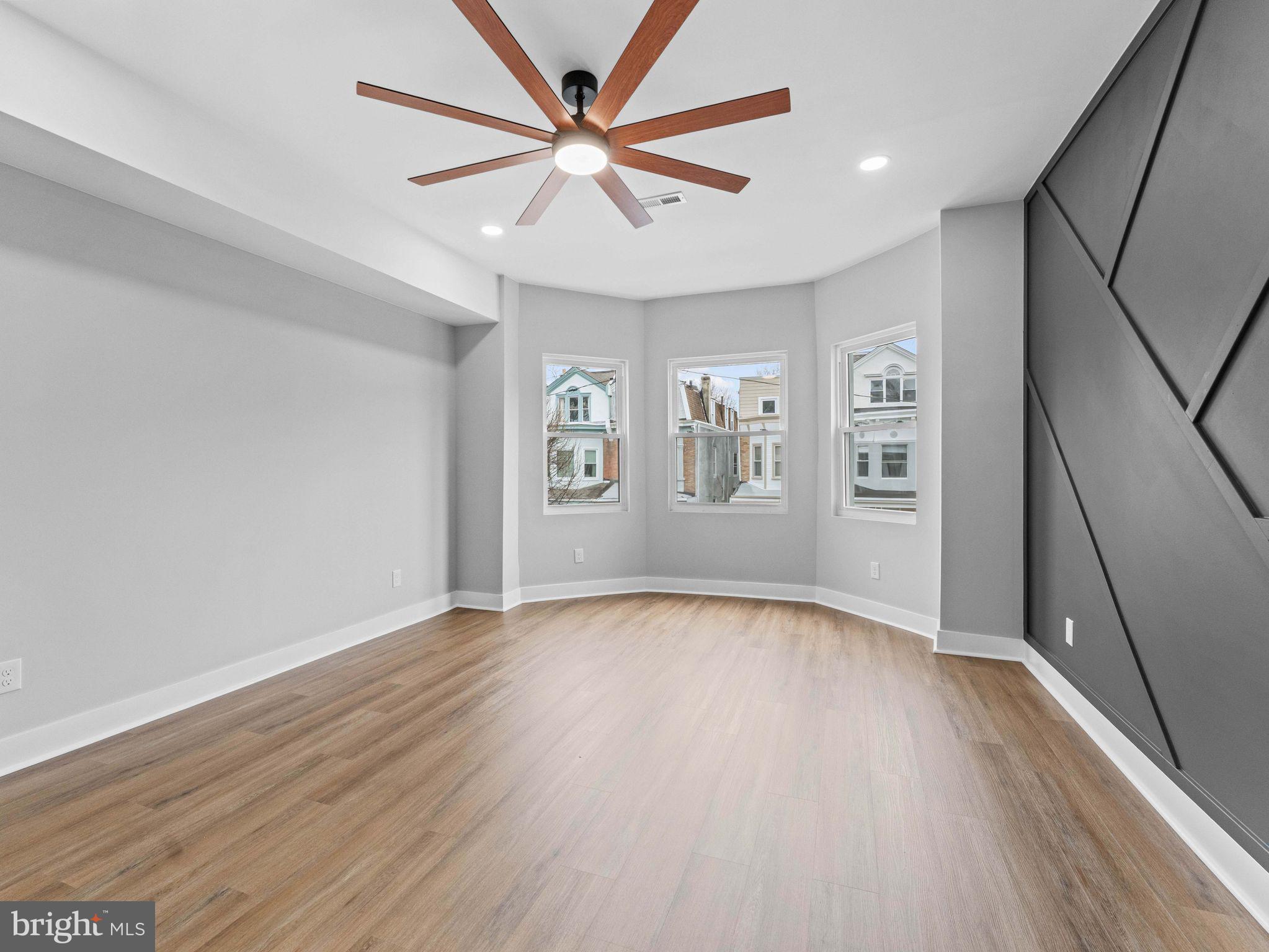 138 West Sharpnack Street Philadelphia, PA 19119 - Photo 20 of 44 wooden floor in an empty room with a window