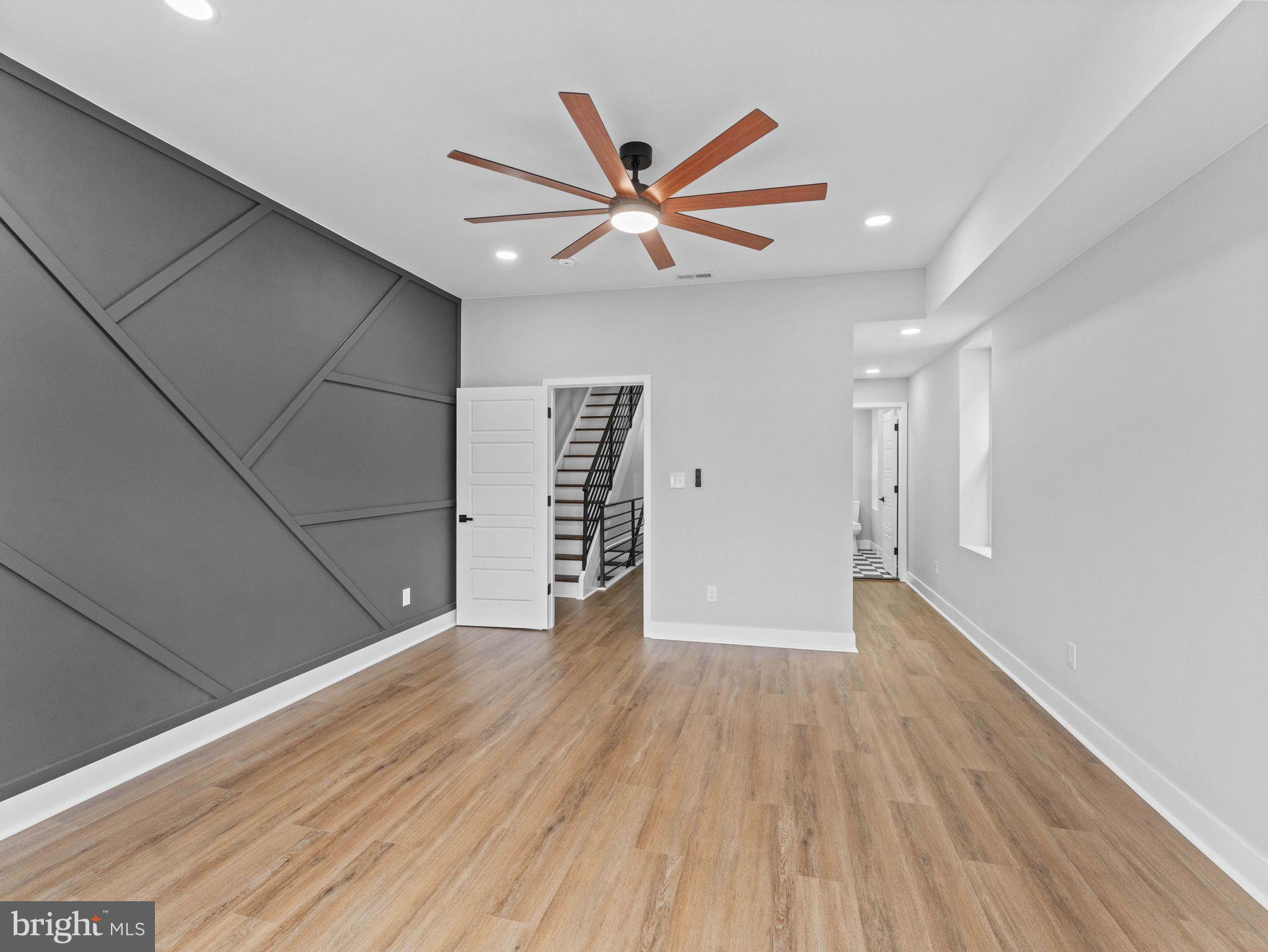 138 West Sharpnack Street Philadelphia, PA 19119 - Photo 23 of 44 a view of an empty room with wooden floor