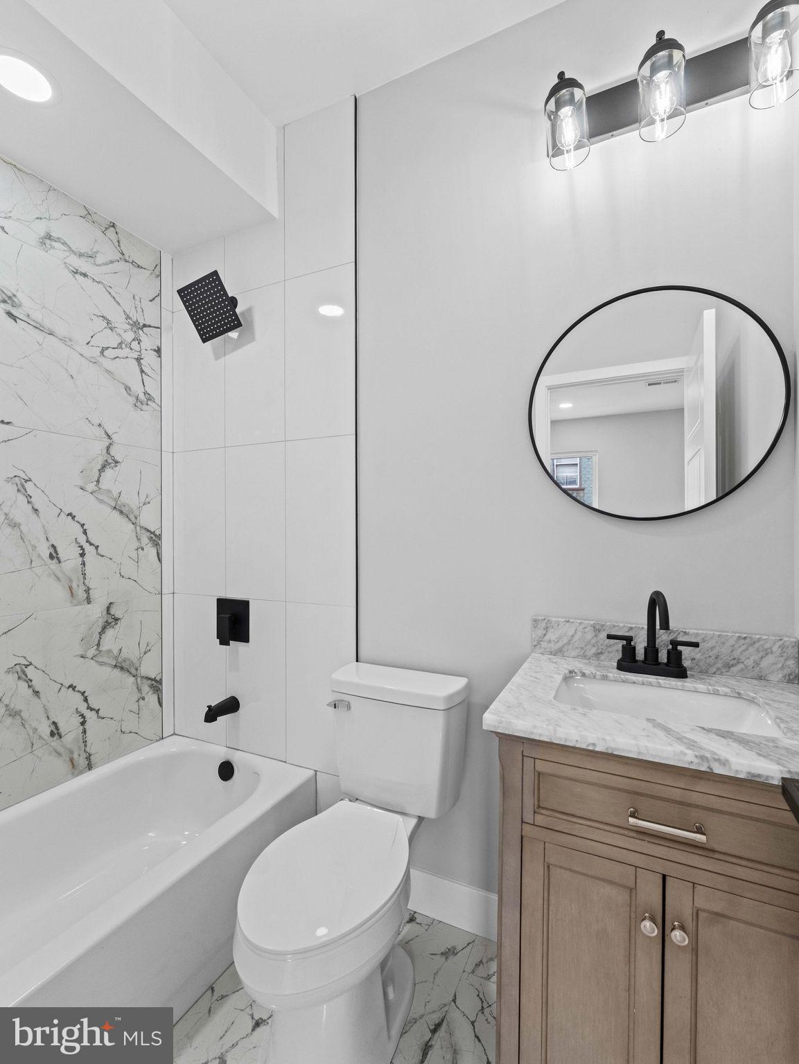 138 West Sharpnack Street Philadelphia, PA 19119 - Photo 28 of 44 a bathroom with a sink a toilet and a bathtub