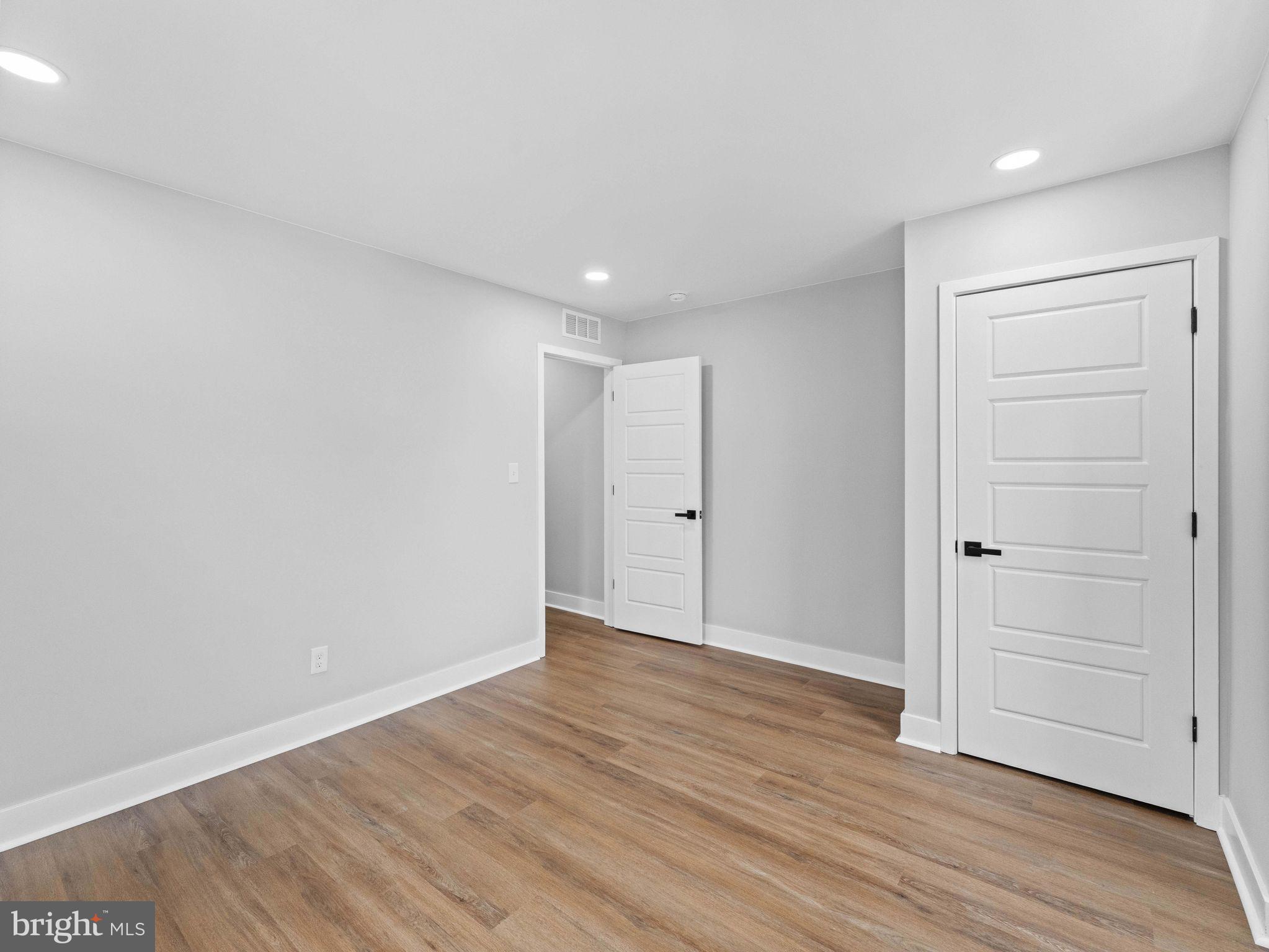 138 West Sharpnack Street Philadelphia, PA 19119 - Photo 34 of 44 a view of an empty room with wooden floor