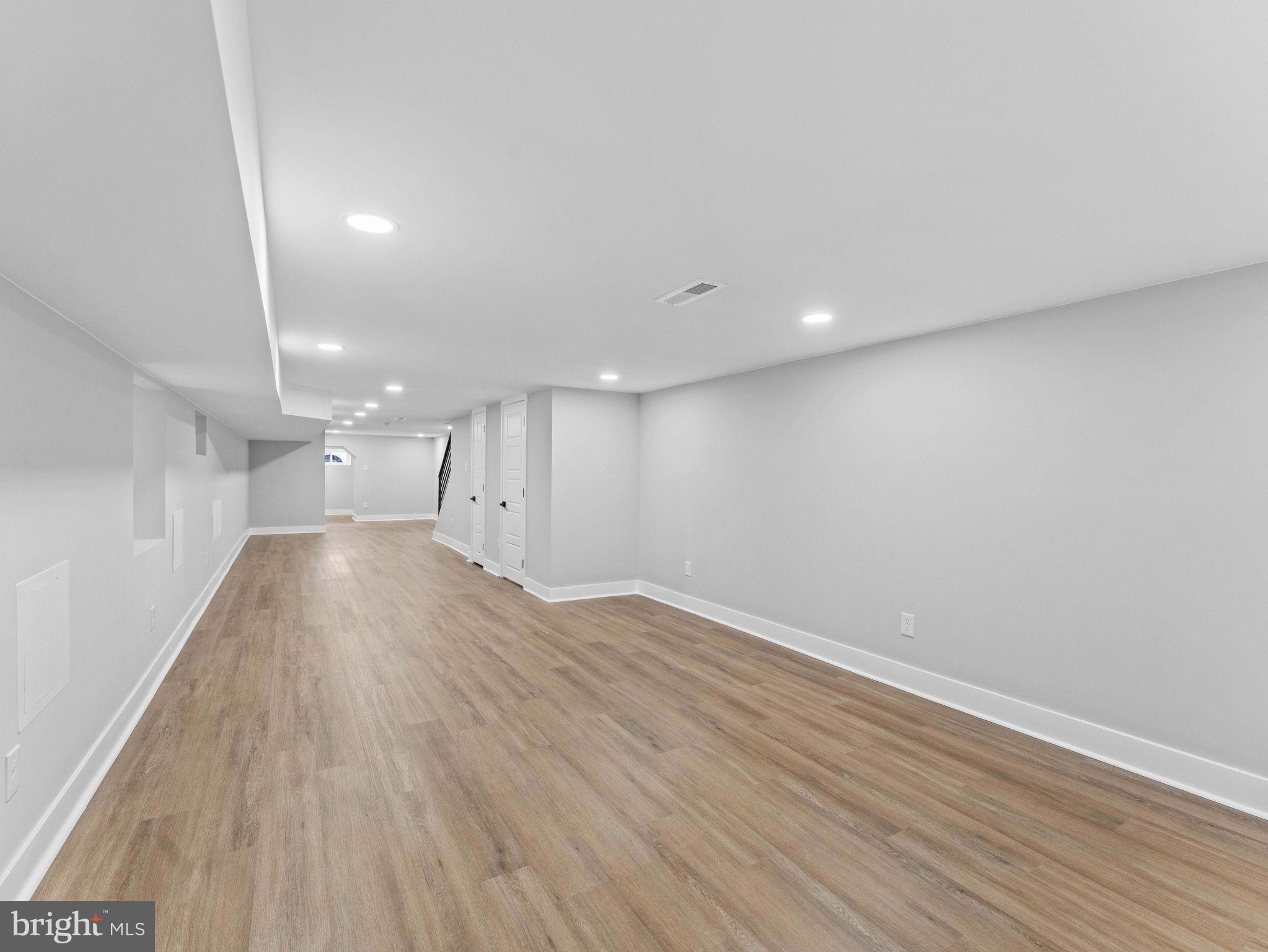 138 West Sharpnack Street Philadelphia, PA 19119 - Photo 41 of 44 a view of empty room with wooden floor