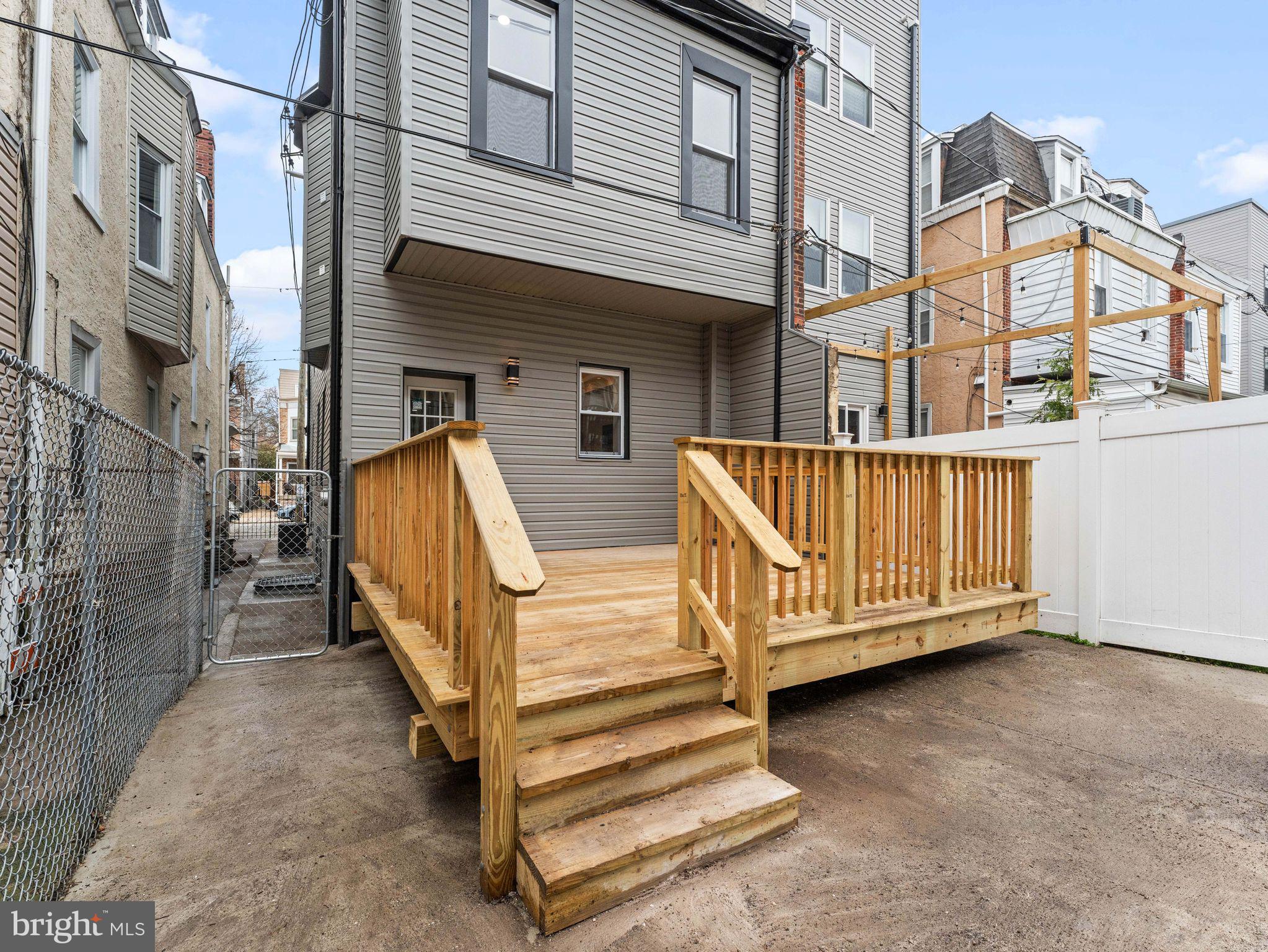 138 West Sharpnack Street Philadelphia, PA 19119 - Photo 44 of 44 a view of a house with a wooden deck