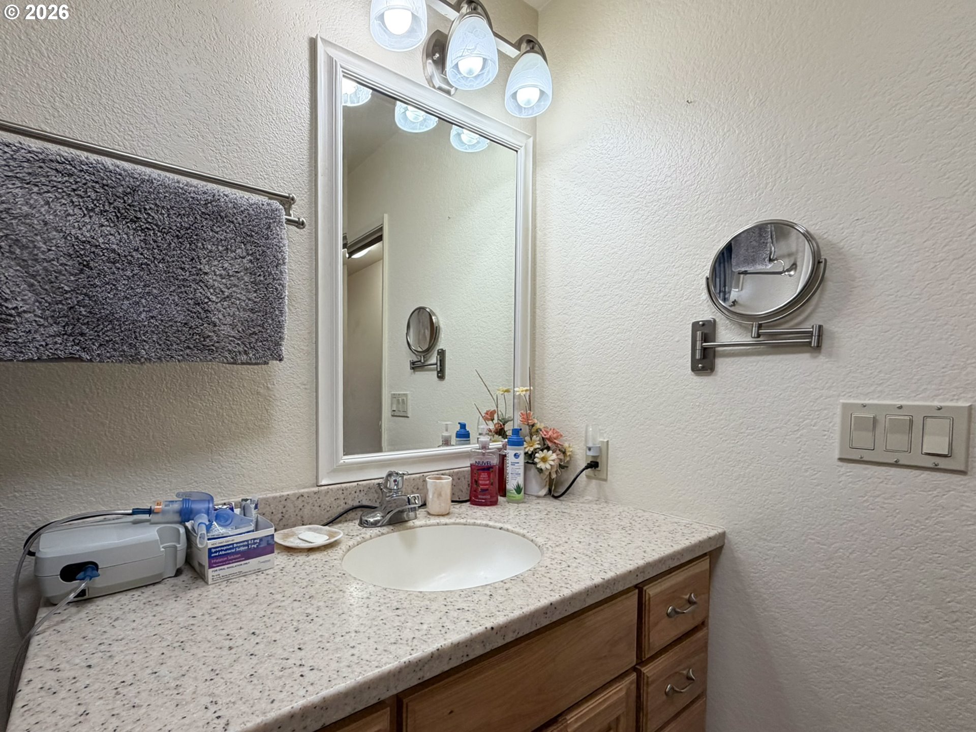 1372 Hampton Road Brookings, OR 97415 - Photo 22 of 42 a bathroom with a granite countertop sink a mirror and vanity