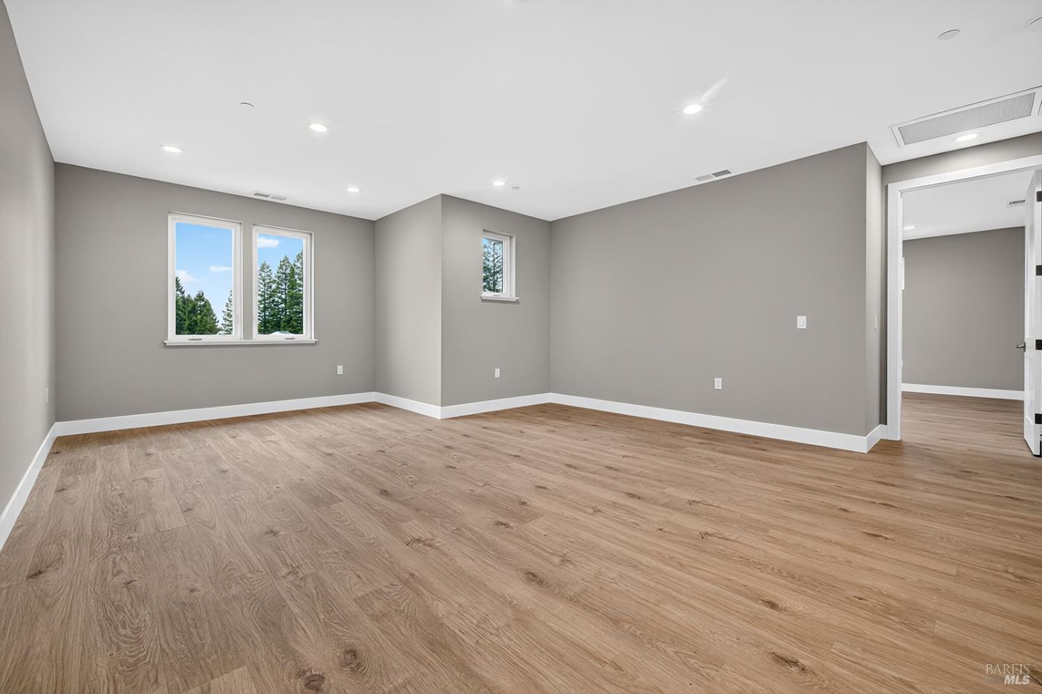 1913 Carlile Place Santa Rosa, CA 95403 - Photo 32 of 60 This space would also make a great game room.....Billards anyone? The door entry to the right of this photo leads to the oversized Primary Suite. One of two suites offered with this home for multi-generational living!