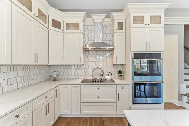 a kitchen with stainless steel appliances a sink and cabinets