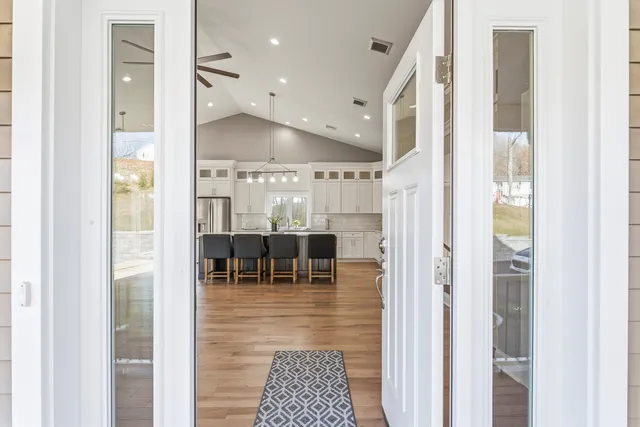 a view of dining room with stainless steel appliances kitchen island