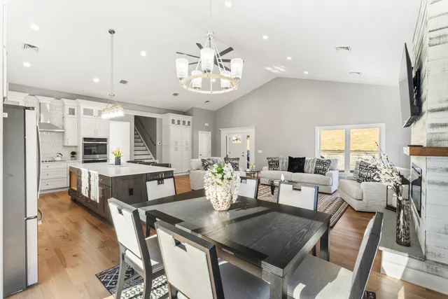 a large kitchen with a table and chairs